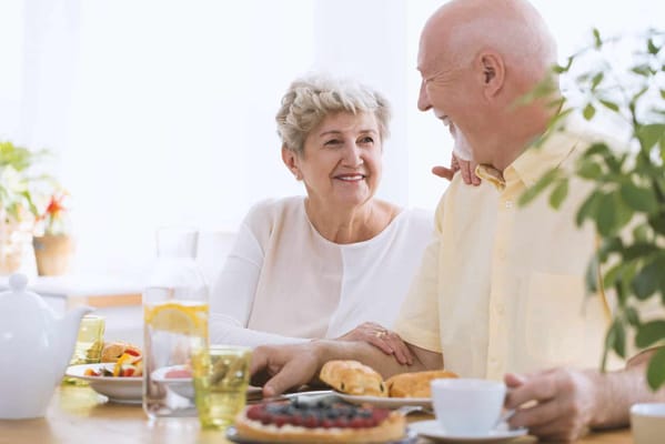 Seniors enjoying a meal together in a dining area