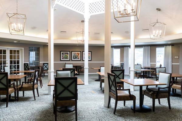 Bright dining area with tables and chairs