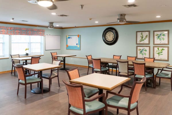 Interior view of a dining area with tables and chairs