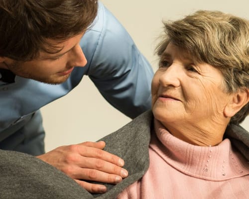 Caregiver interacting with an elderly resident