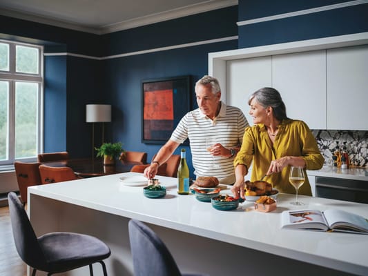 Couple preparing a meal together in a kitchen