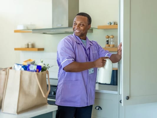 Staff member preparing to assist in the kitchen