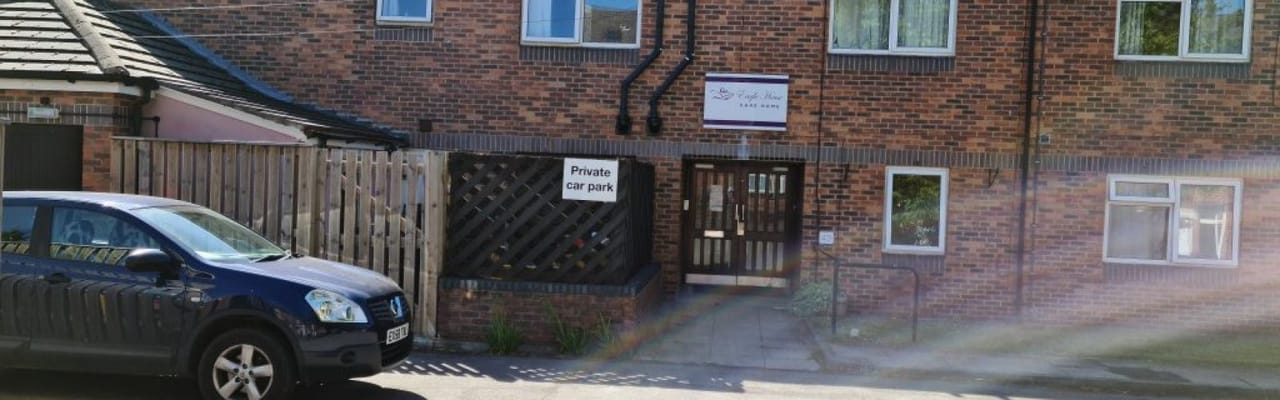 Exterior photo of Eagle House with a parked car