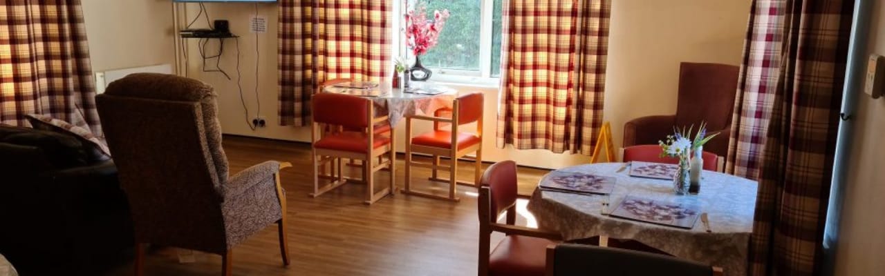 Cozy common area with seating and dining tables