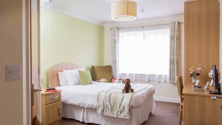 Cozy resident room with a bed and furniture