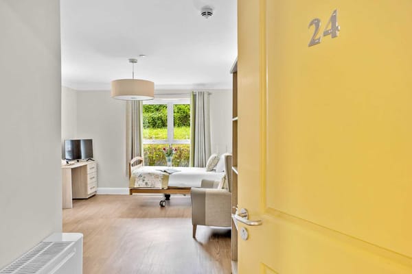 Interior shot of a resident room with yellow door