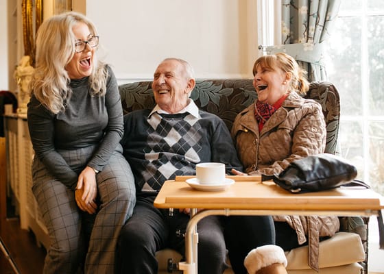 Residents enjoying laughter in a cozy common area