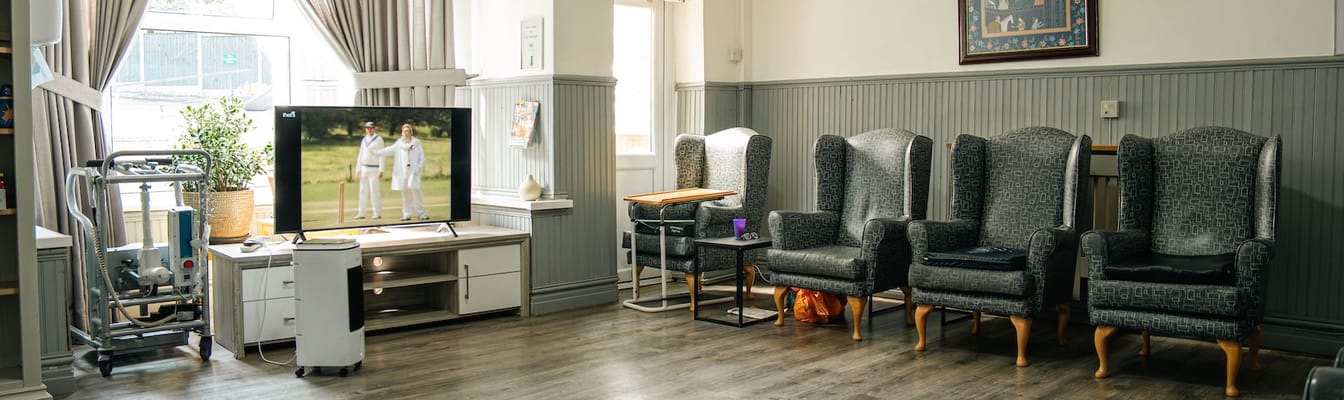 Interior common area with seating and a television