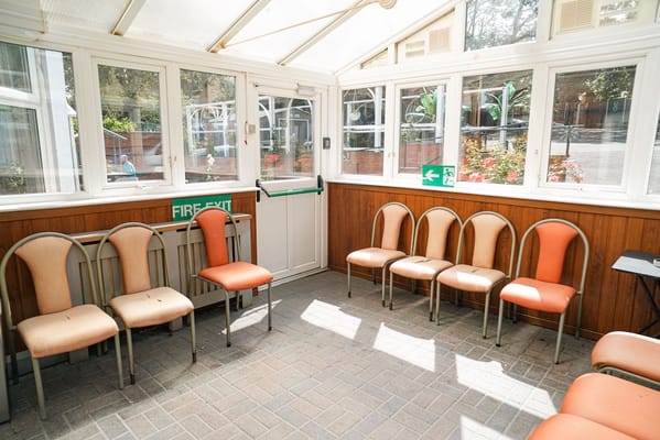 Bright seating area in a common space with chairs
