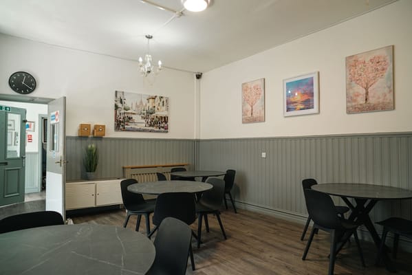 Cozy dining area with tables and wall art