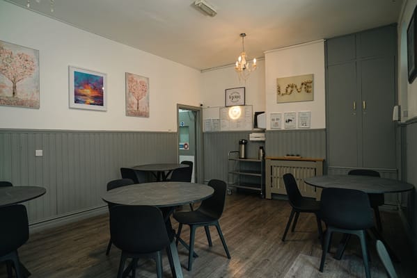 Interior of a dining room with tables and chairs