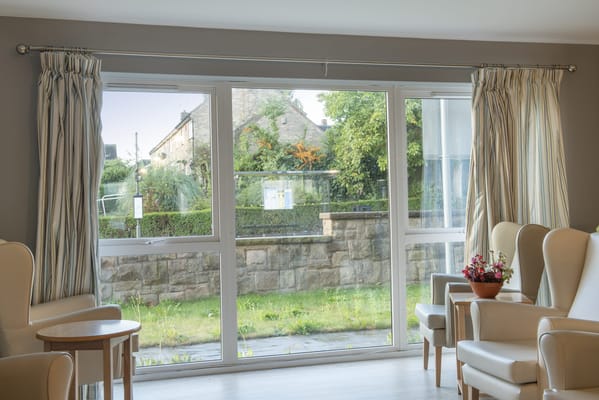 Bright common area with seating and outdoor view