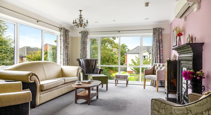 Bright common area with comfortable seating and windows