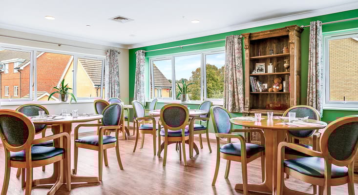 Bright dining room with tables and chairs