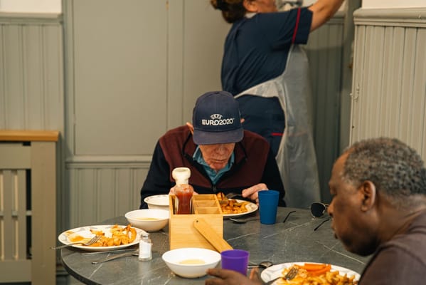Residents enjoying a meal in the dining area