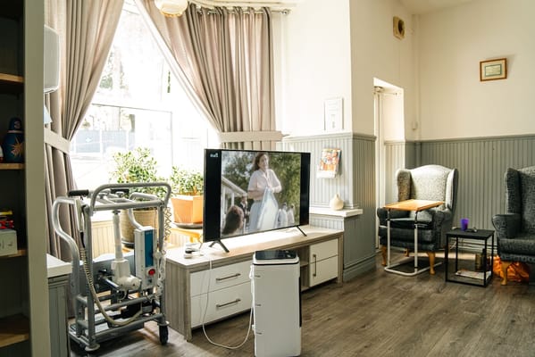 Common area with seating and a television