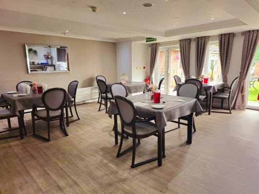 Dining area with tables set for residents