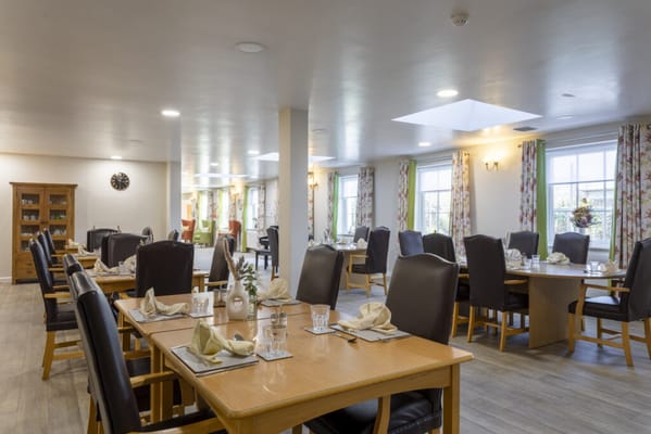 Bright dining area with tables and chairs