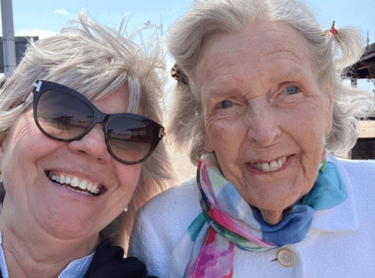 A joyful selfie of a staff member with a resident