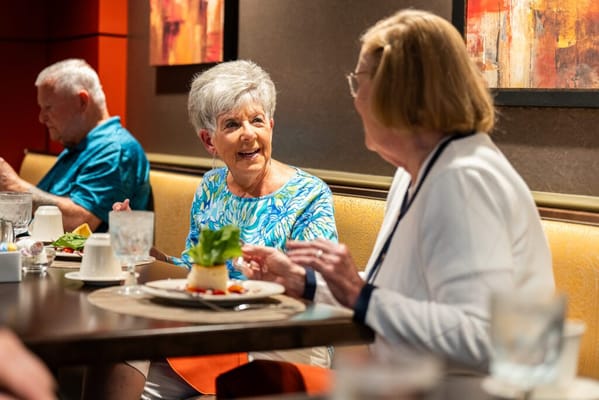 Residents enjoying a meal in the dining area