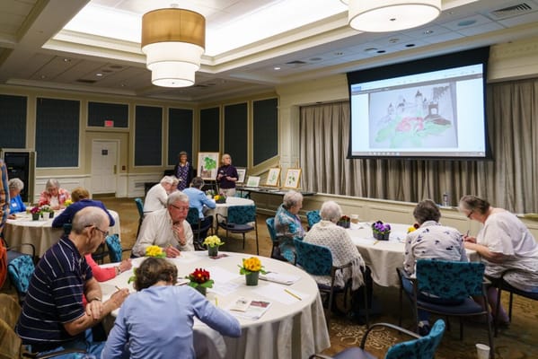Residents participating in an arts and crafts activity in a common area