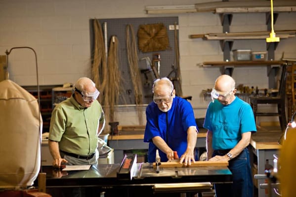 Residents engaged in woodworking activity