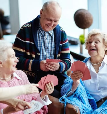 Residents playing cards in a common area