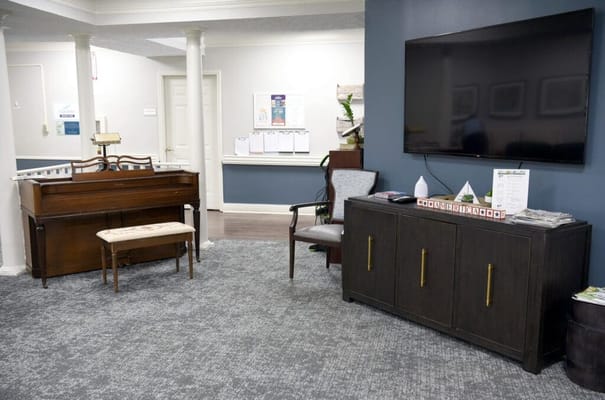 Common area with seating and TV