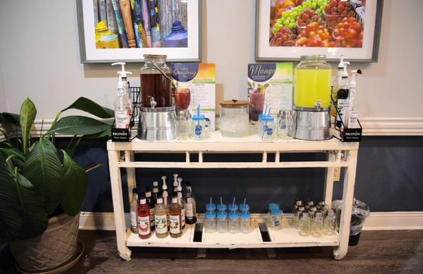 Beverage station with various drinks and dispensers