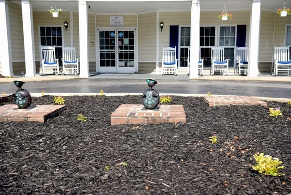 Garden area in front of the facility with decorative items