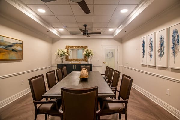 Bright, modern interior of a meeting room with chairs and art