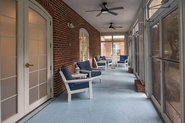 Interior view of a sunroom with seating