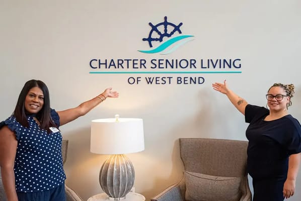 Two staff members promoting Charter Senior Living of West Bend