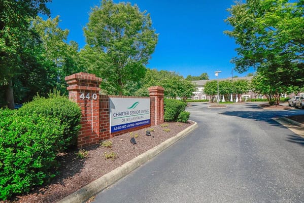 Exterior view of Charter Senior Living sign and entrance