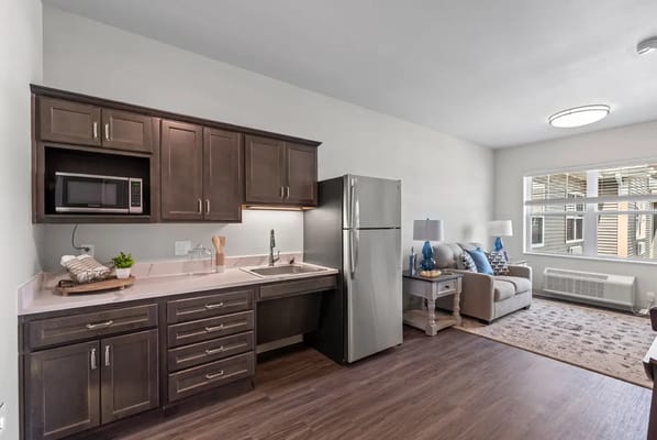 Bright interior of a resident's room with kitchen area