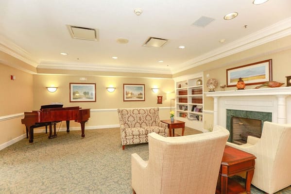 Interior common area with chairs and a piano