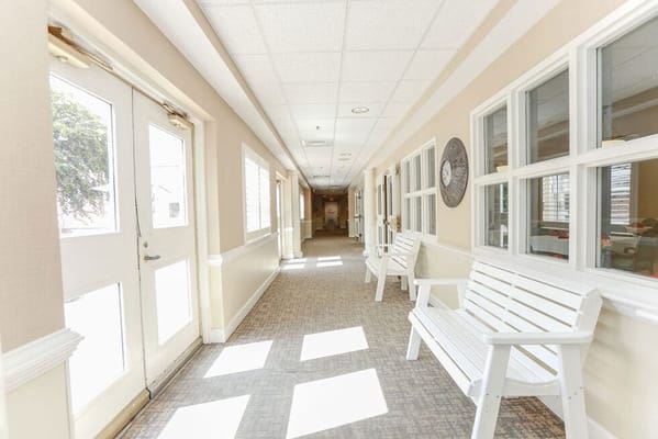 A bright, empty hallway in a senior living facility