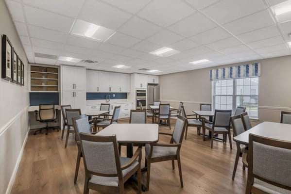 Bright common area with tables and chairs