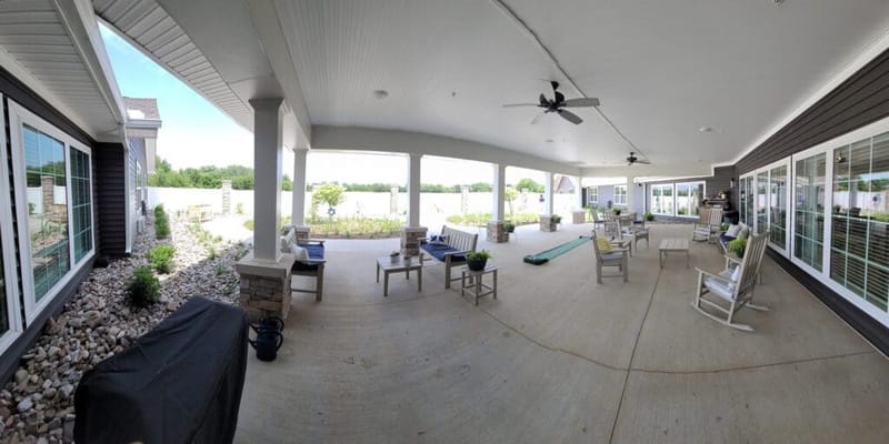 Outdoor patio area with seating and plants