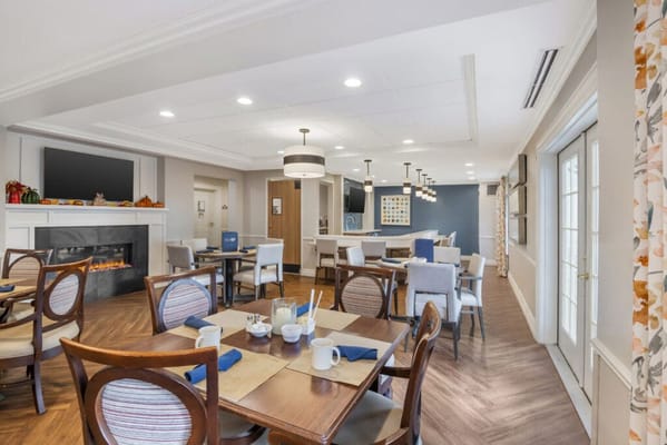 Cozy dining area with tables and chairs