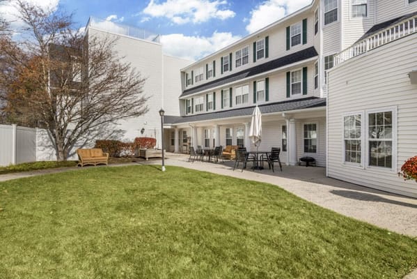 Outdoor area with seating and greenery at the facility