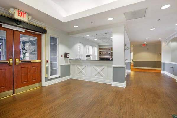 Bright and welcoming lobby area with seating and reception desk