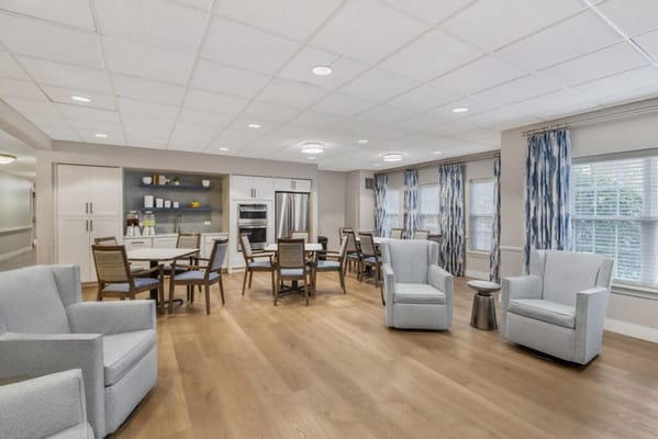 Bright common area with seating and natural light