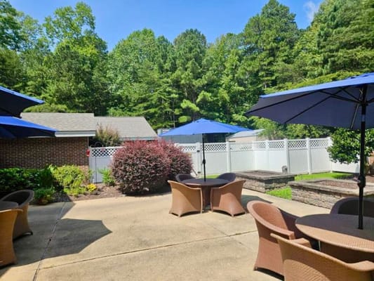 Outdoor patio area with tables and umbrellas