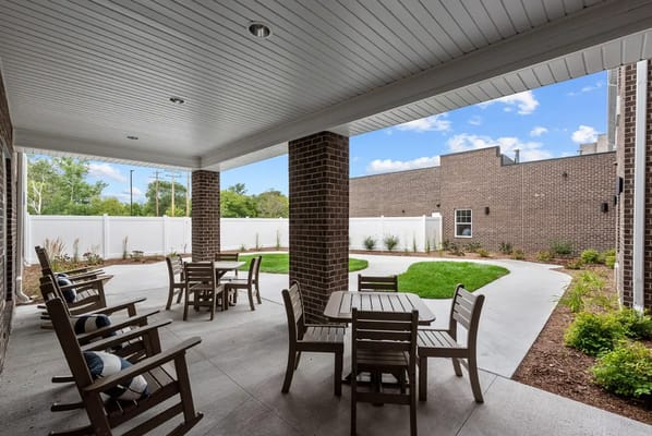Outdoor seating area with tables and chairs
