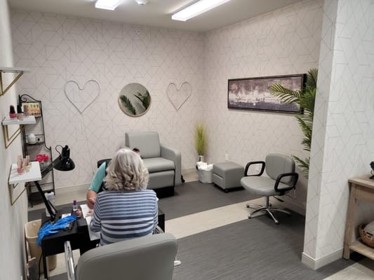 Residents enjoying a manicure in the salon area