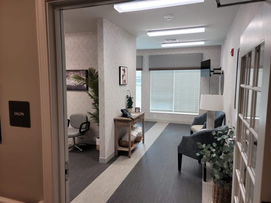 Interior of a salon area with seating and decor