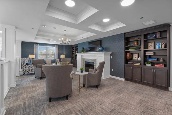 Interior common area with cozy seating and fireplace