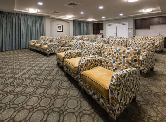 Interior view of a common area with patterned sofas