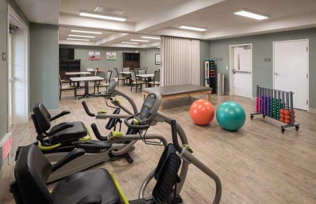 Interior fitness area with exercise equipment and balls
